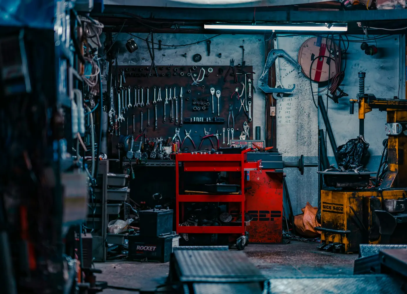 Tool wall and trolley in a working repair shop